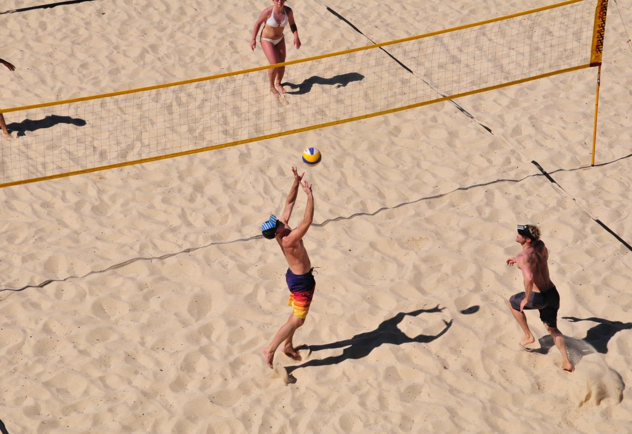 People playing beach volleyball 